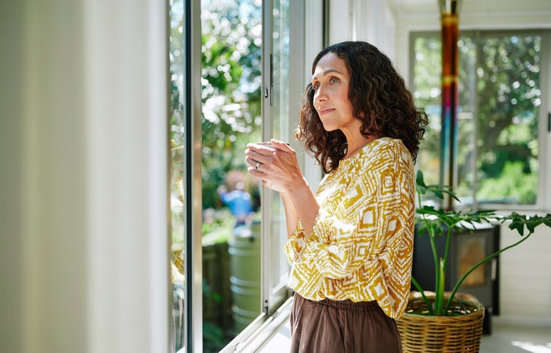contemplative woman looking out the window