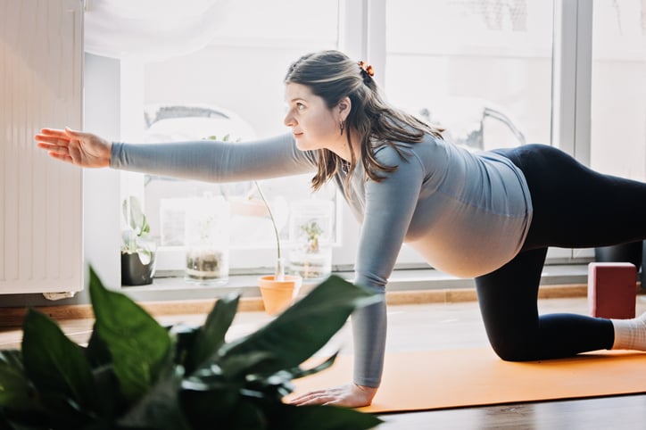 pregnant woman doing yoga