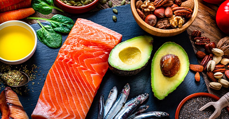 salmon, avocado and other foods on table