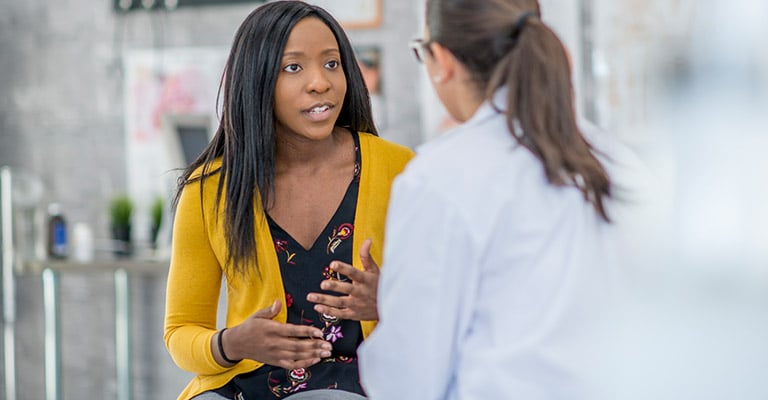 woman talking with her provider about her concerns