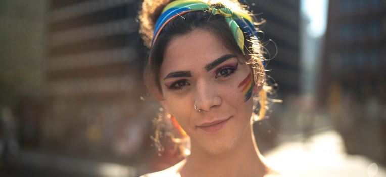 nonbinary individual smiling at the camera