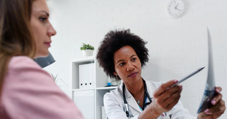 female-doctor-explaining-result-to-patient-1