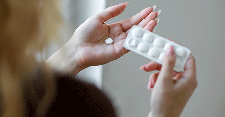 pack of pills in hand