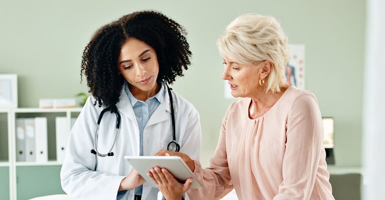 provider and patient looking at ipad