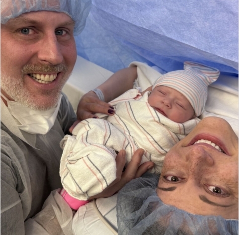 Julie and husband welcoming daughter