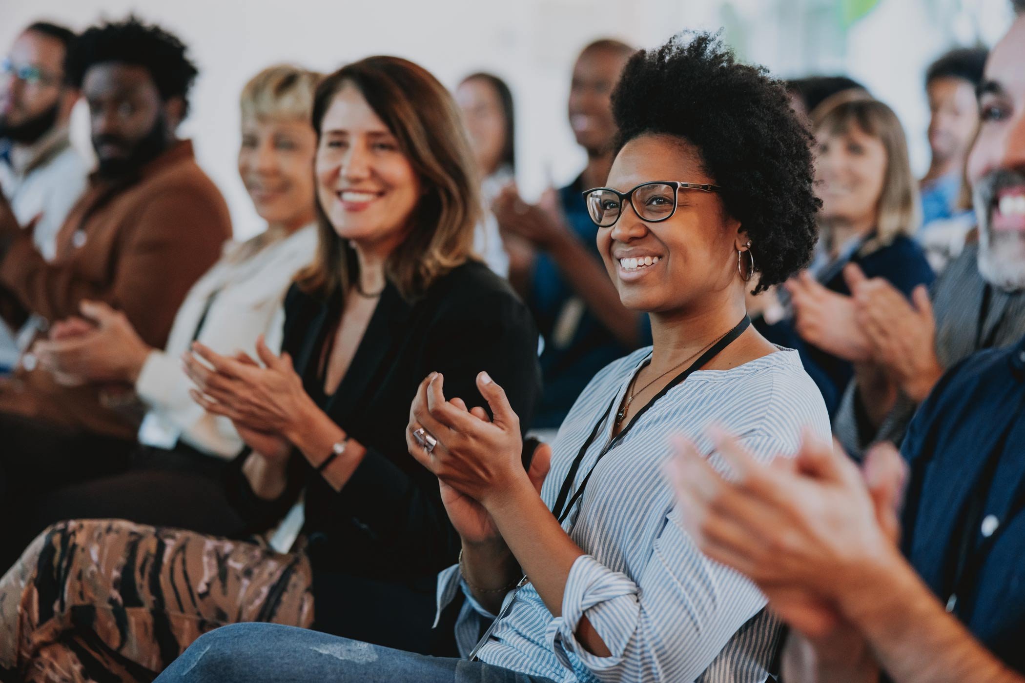 an-audience-of-colleagues-clapping-during-work-event