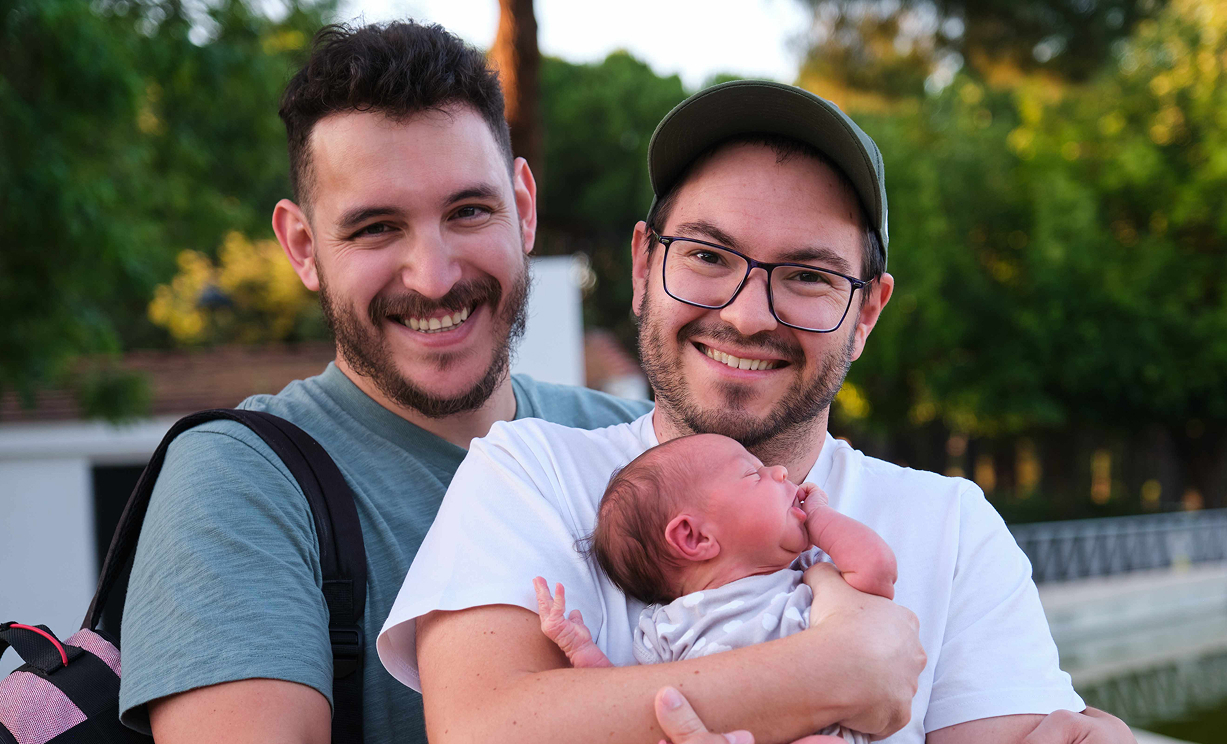 gay male couple with their newborn