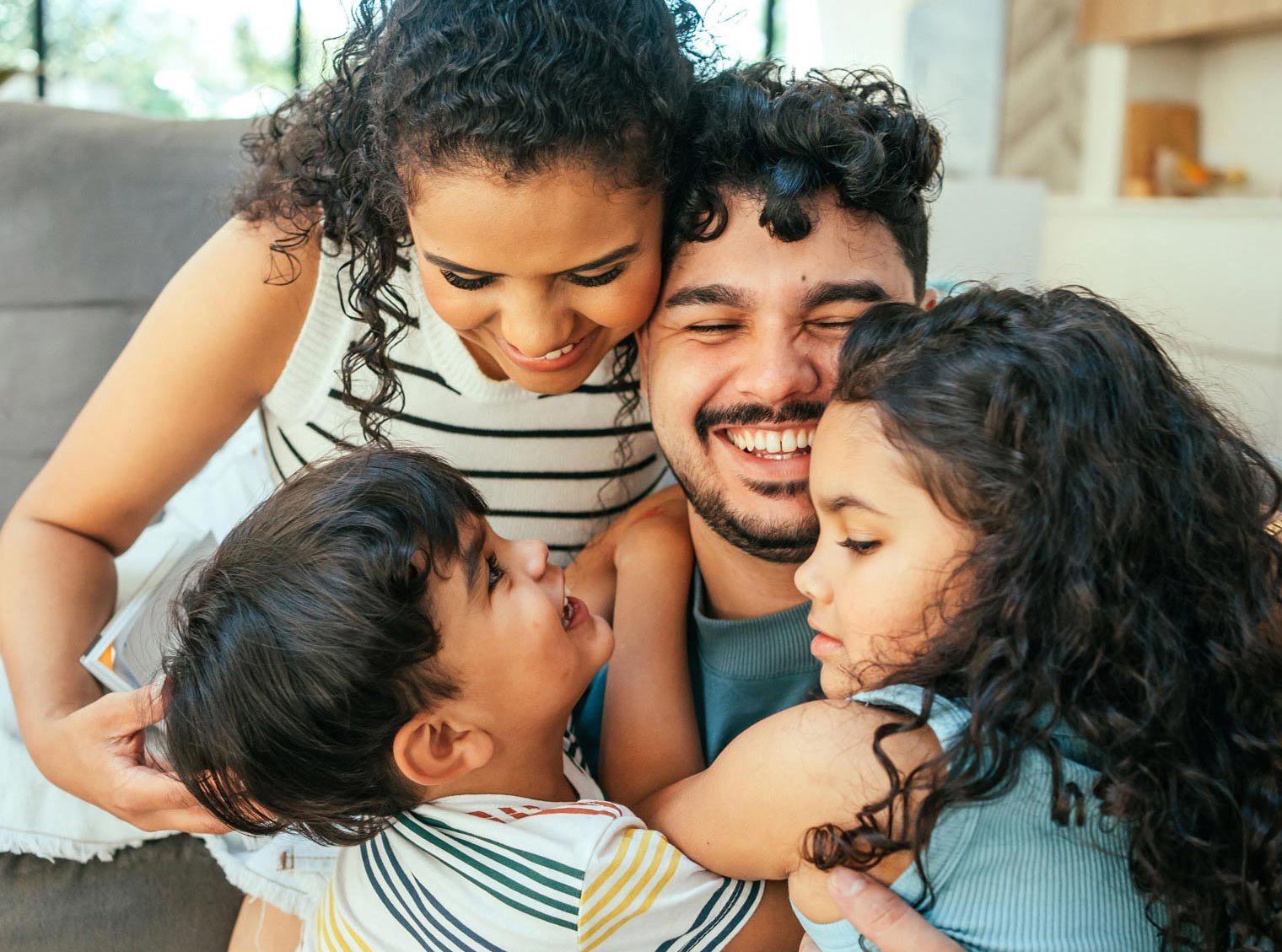 smiling-family-of-four-full-size-crop