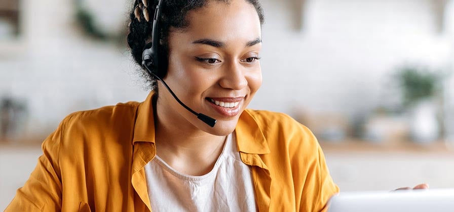 woman-with-headset-talking-on-phone-cropped