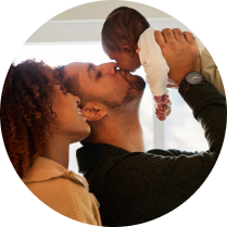 couple holding up their baby