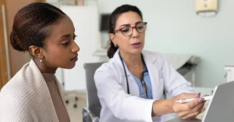 doctor-reviewing-laptop