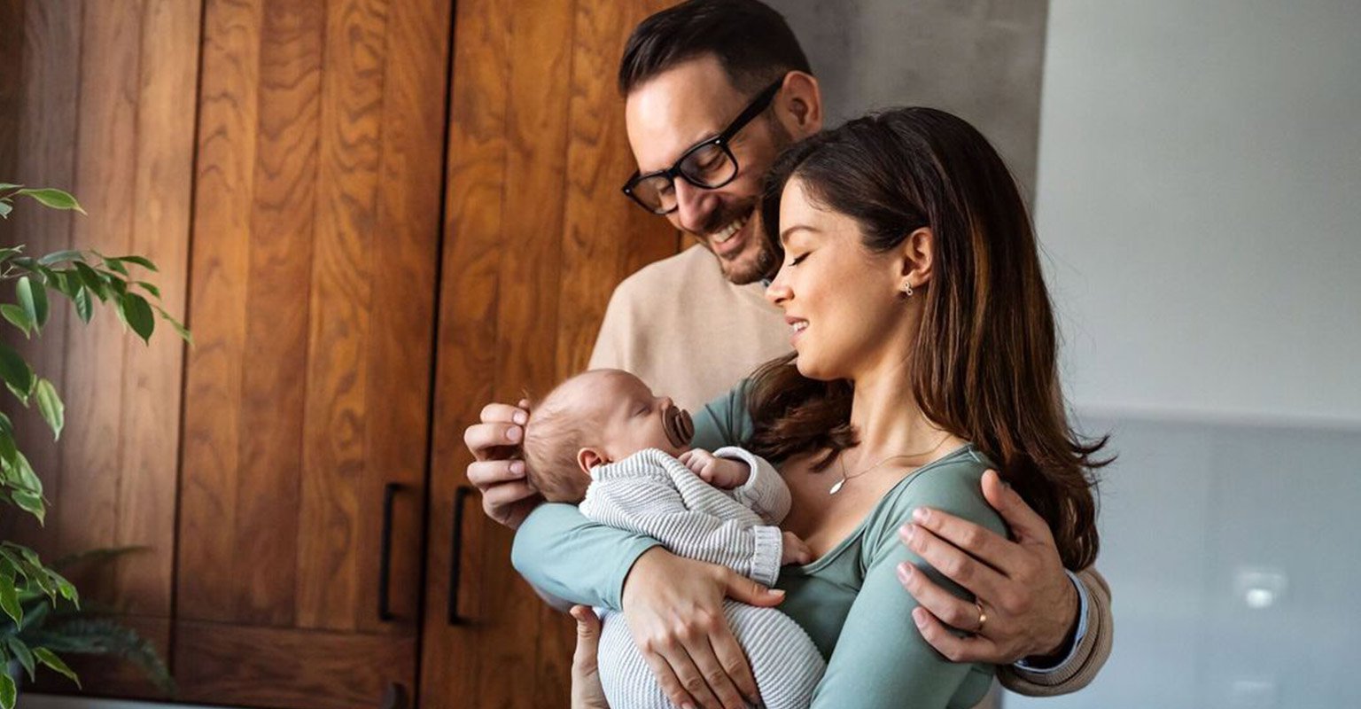 happy-couple-with-newborn