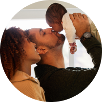 couple holding up their baby