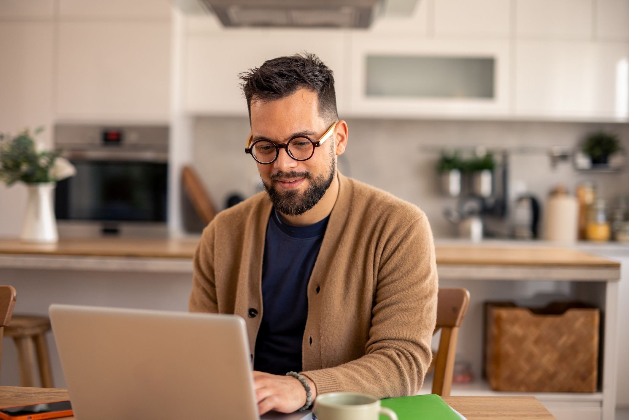 man-with-glasses-on-his-computer