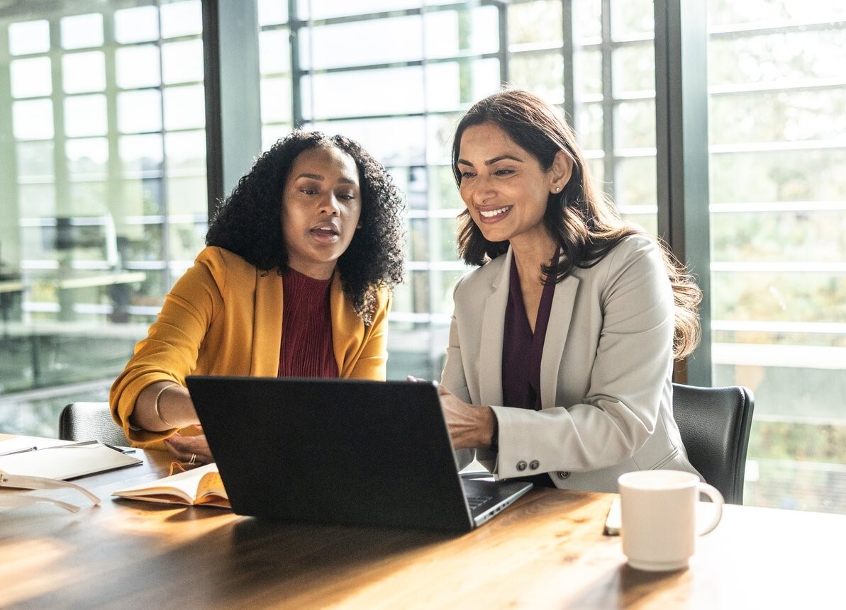 two-businesswomen-reviewing-laptop-screen