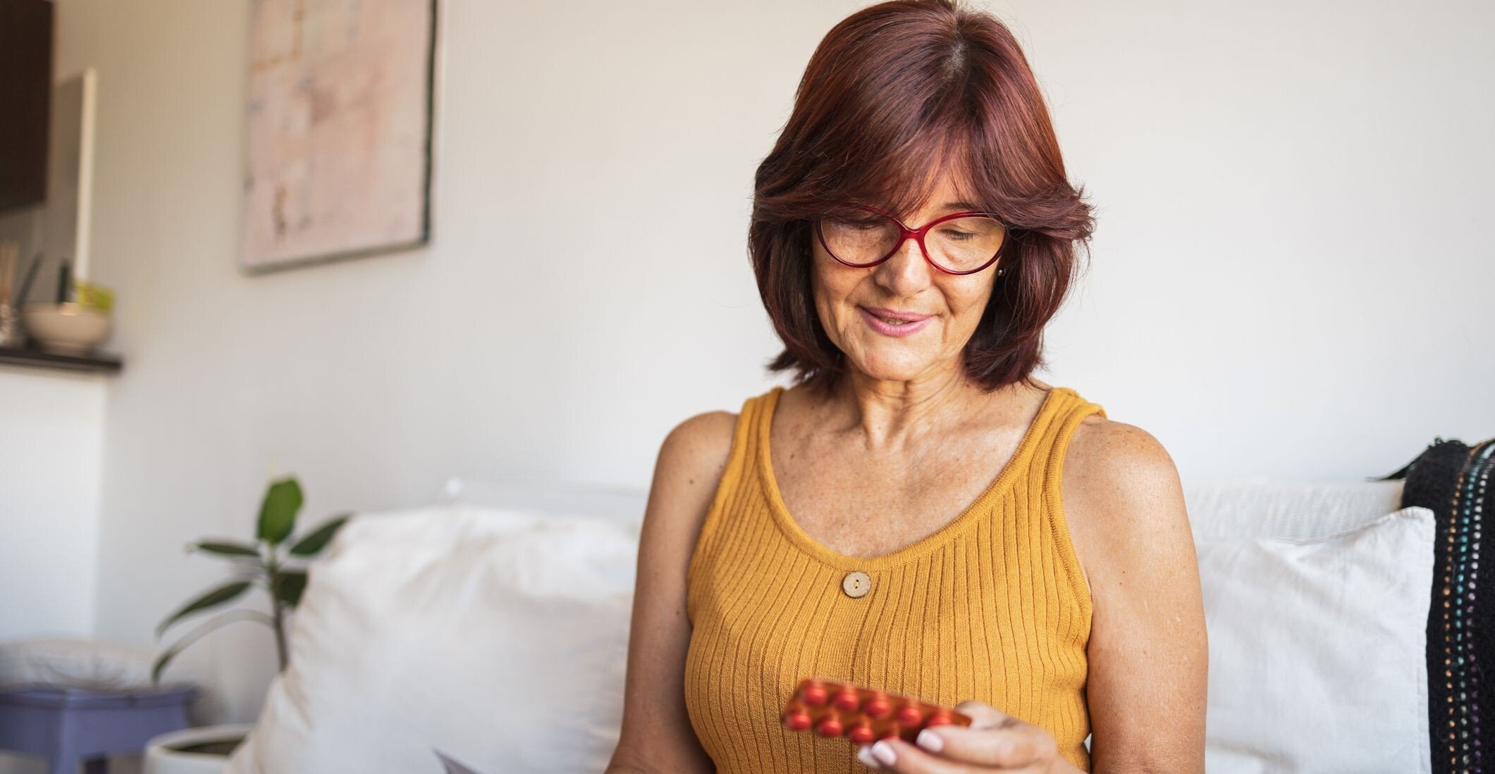 woman-in-midlife-reviewing-a-pill-pack-cropped