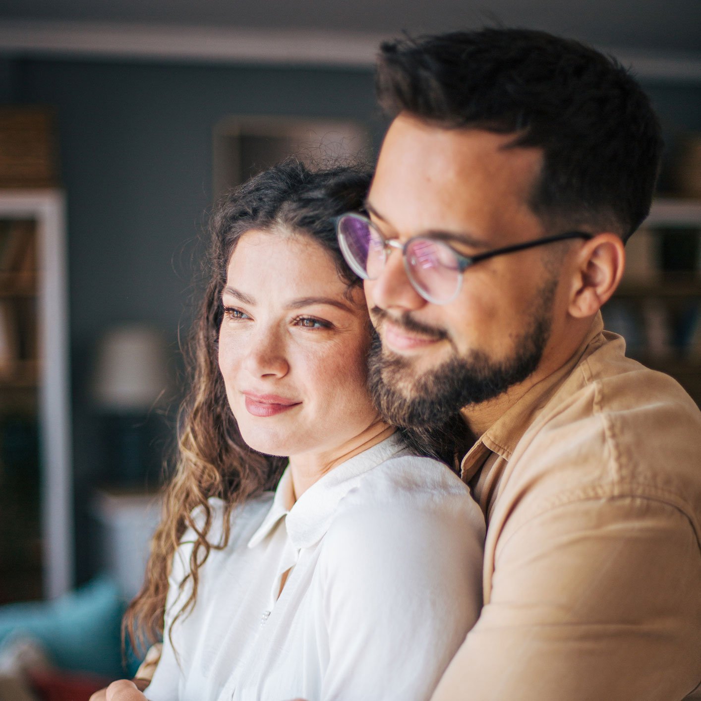 young-couple-embracing-at-home-square