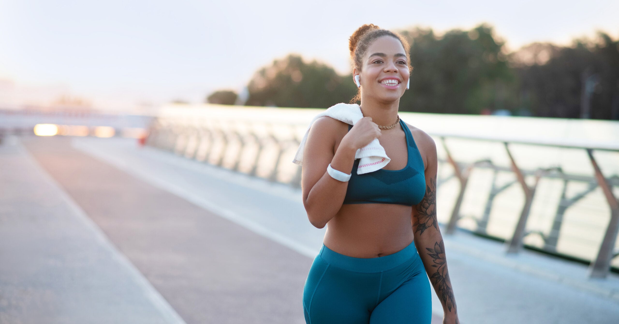 woman in workout attire walking in the park