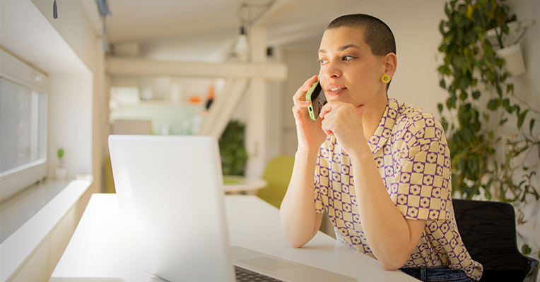 seated woman on the phone talking to PCA