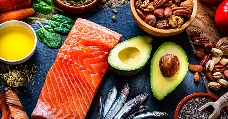 salmon, avocado and other foods on table