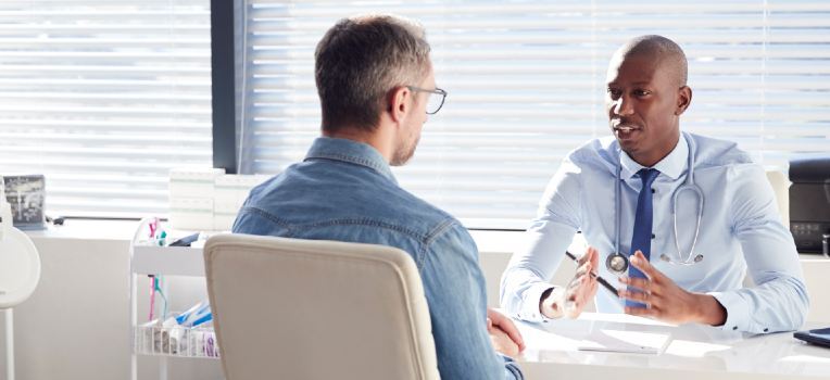 doctor in discussion with his patient at the office