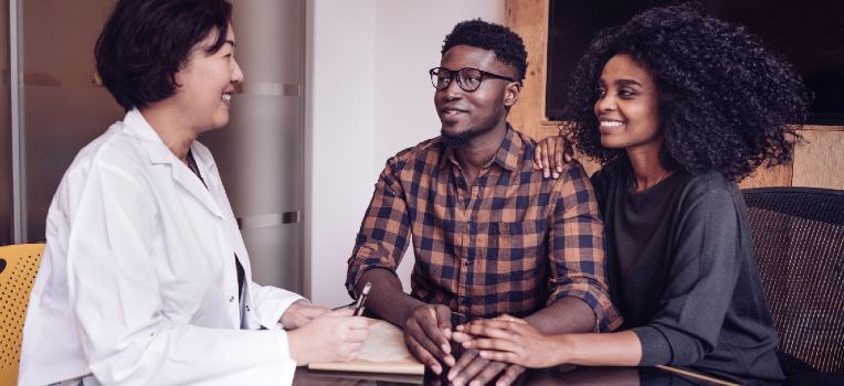 couple talking with their provider in the office