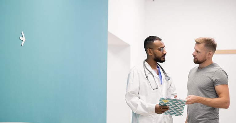male discussing his concerns with provider