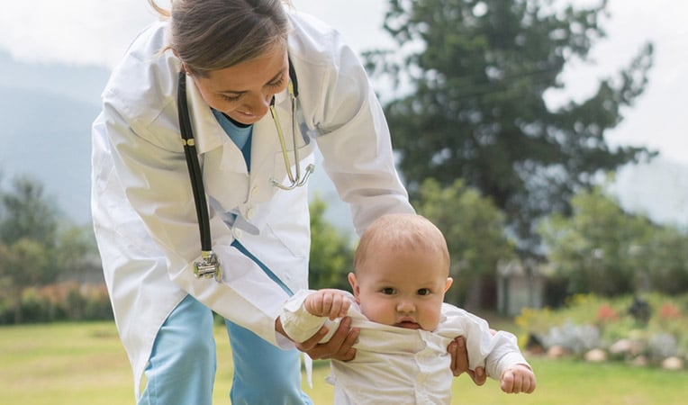 doctor walking with a baby
