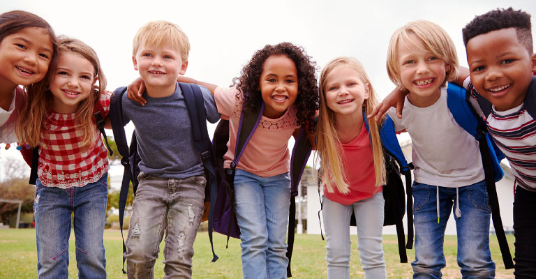 group of happy schoolchildren