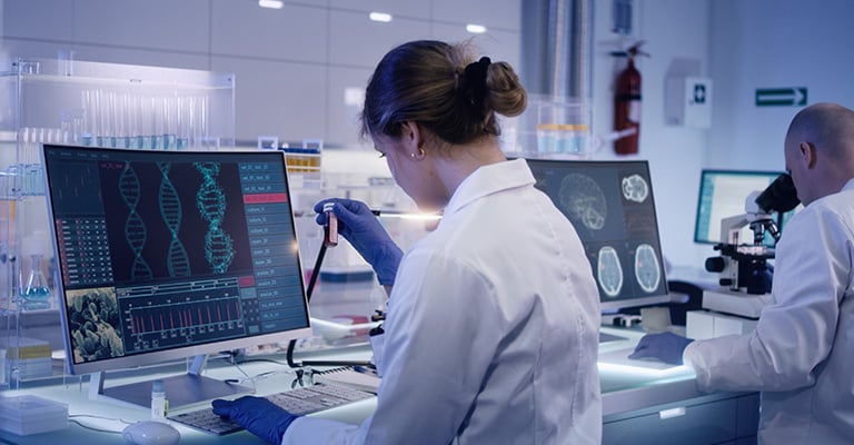 scientist in a lab measuring results