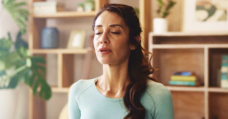 woman deep breathing for stress management
