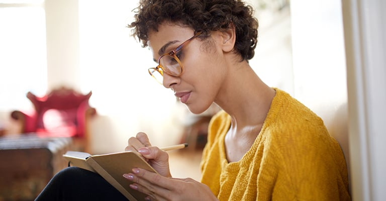 woman journaling for stress relief