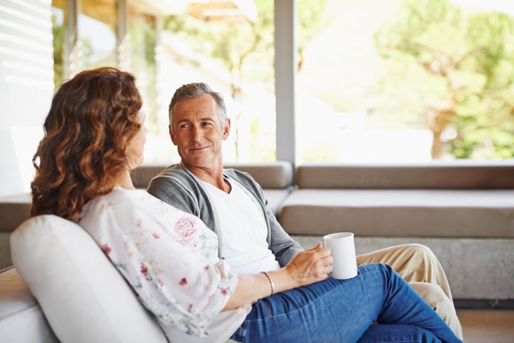 couple seated on their porch in the morning