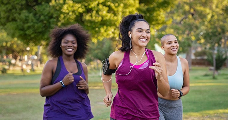 group of women jogging in the park
