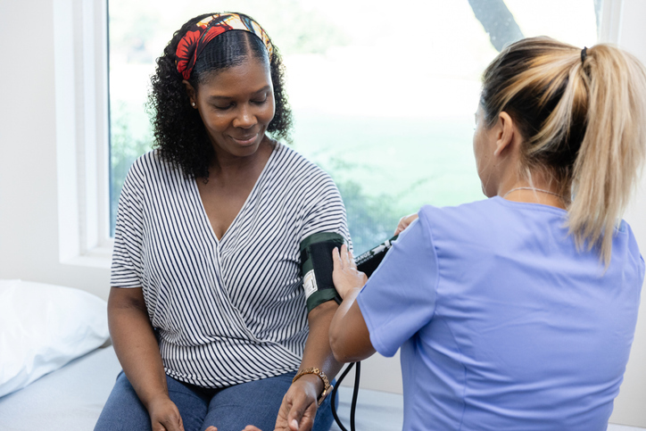 woman getting her blood pressure read