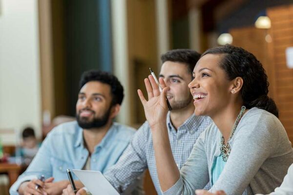 3 people asking questions about their benefit during open enrollment