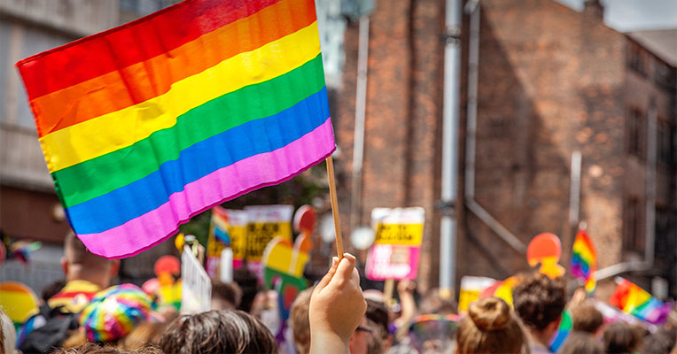 rainbow flag waved at Pride parade