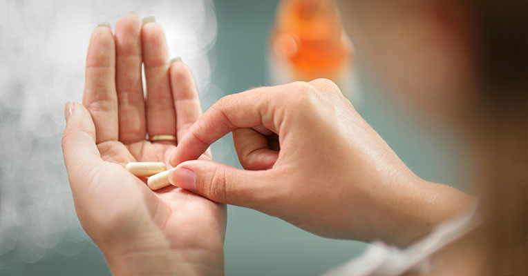 image of vitamins in hand