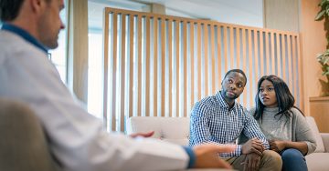 Black couple discussing fertility with reproductive endocrinologist