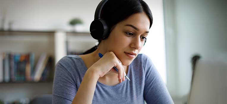 woman with headphones working