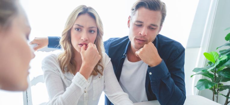 couple thinking deeply about their fertility options