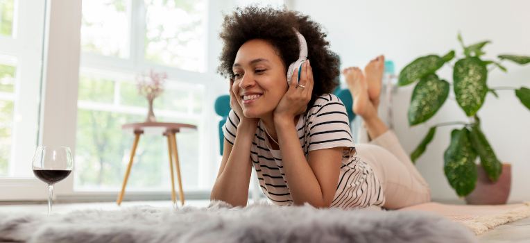 woman enjoying music on headphones