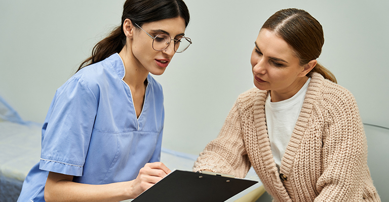 patient and provider looking over notes