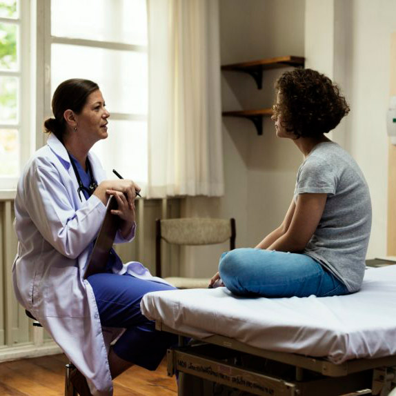 seated doctor and patient during consultation