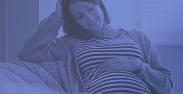 pregnant woman on blue background