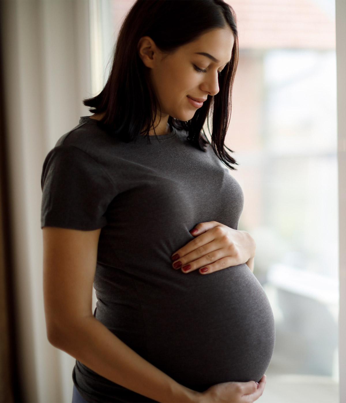 pregnant woman gazing downward
