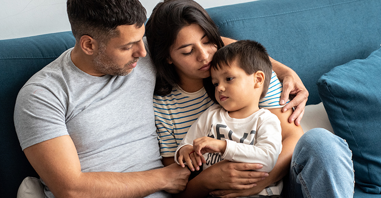 family of three on the couch