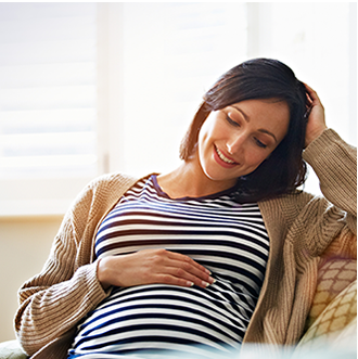 pregnant woman with hand resting on bump