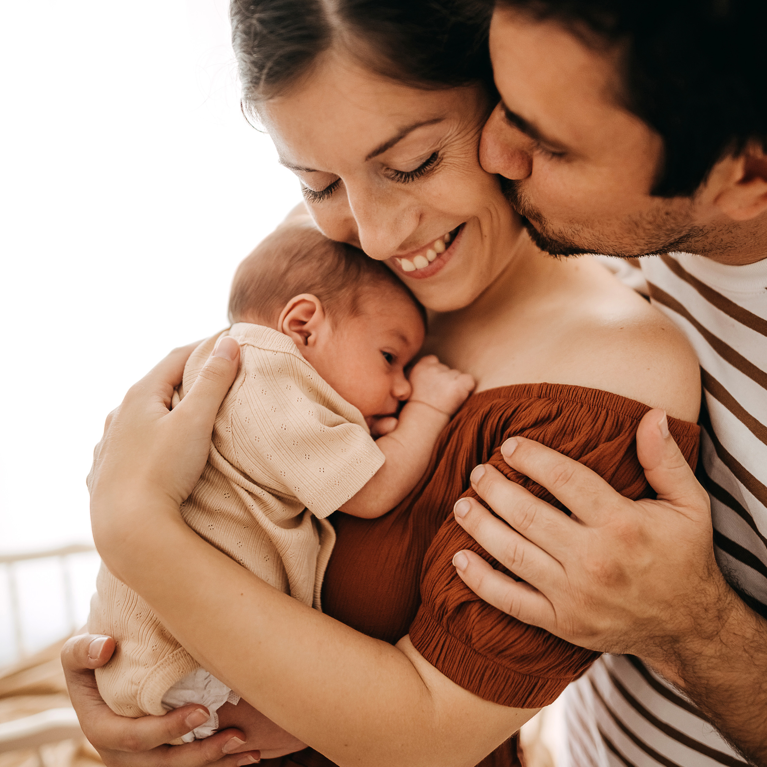 happy couple with infant