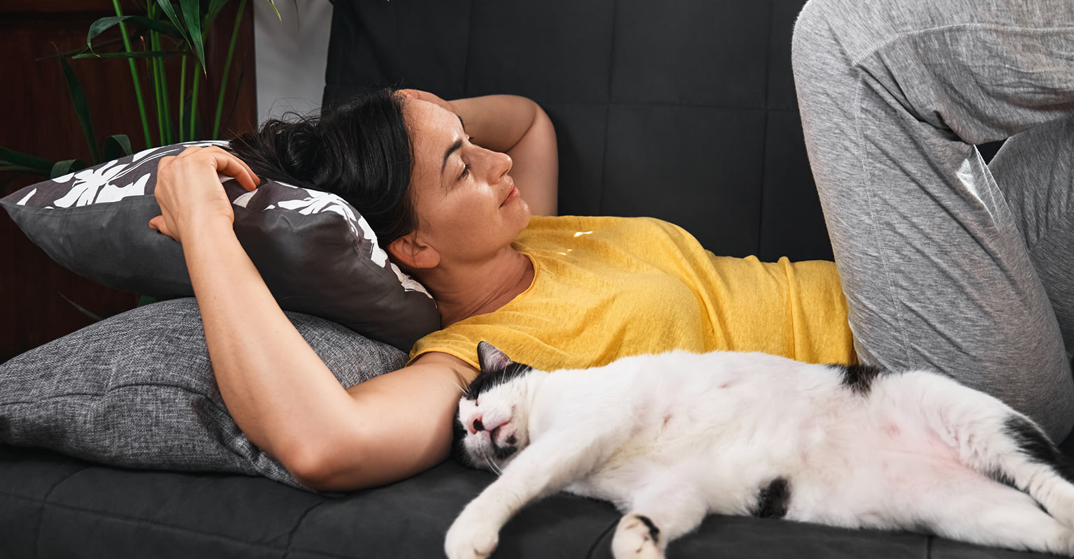 woman lounging with her cat